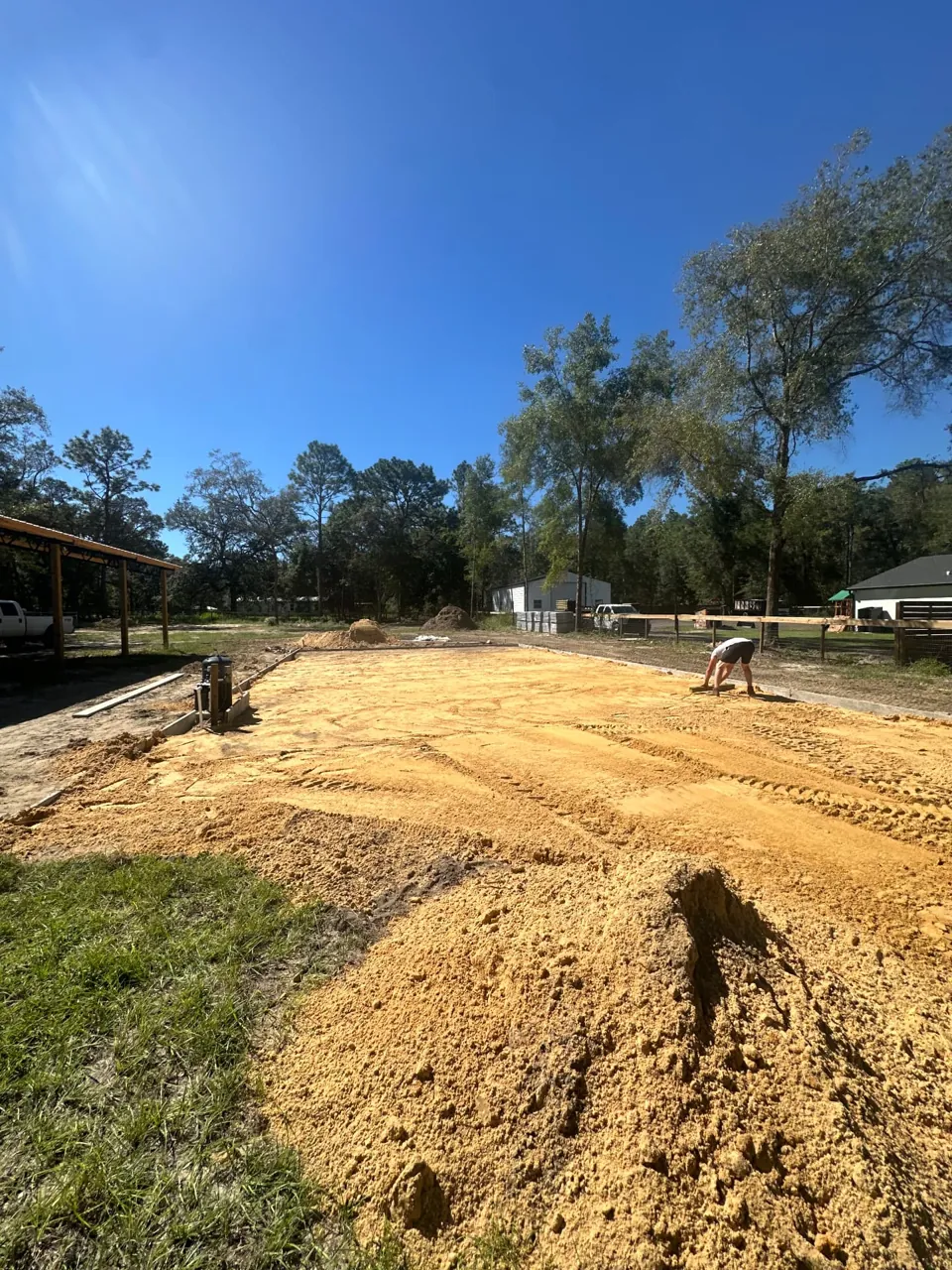 Sand spread across a bordered pad area during Gibson Development Group site grading